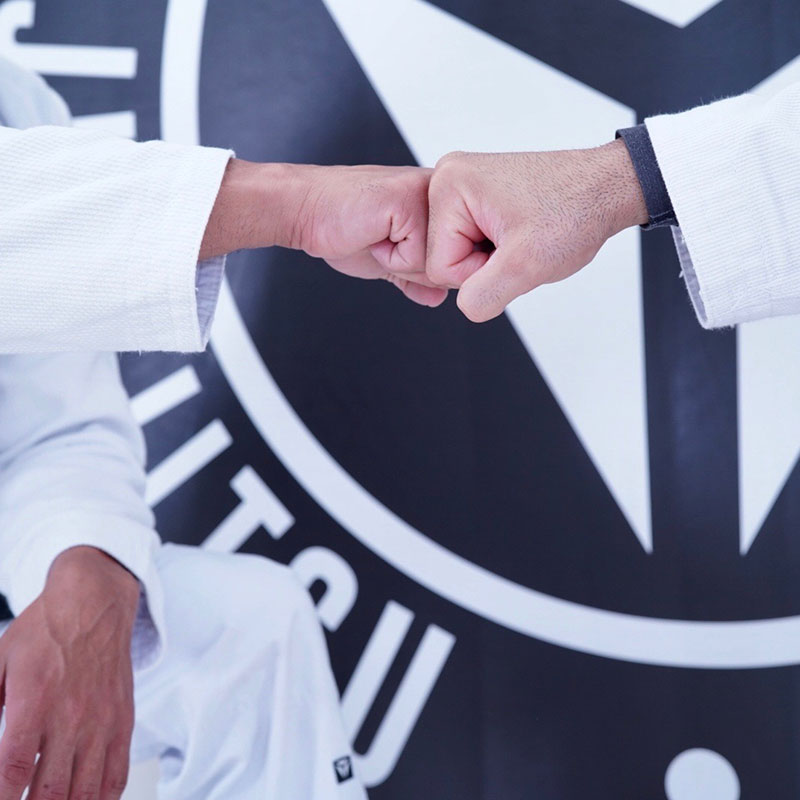 SJJA Hornsby training partners share a fist bump of respect